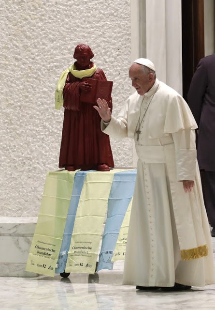 Pope Francis arrives for an audience with Lutheran pilgrims in the Paul VI Hall at the Vatican, Thursday, Oct. 13, 2016. (AP Photo/Alessandra Tarantino)