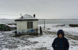 TO GO WITH AFP STORY BY VESSELA SERGUEVA 
A Roma boy walks in a snowy field near the Roma neighborhood of the village of Gorno Ezerovo, near Burgas, Bulgaria, on February 5, 2016.  

Over the past 15 years, the sale of babies in Bulgaria's poor Roma communities has become almost commonplace. Faced with grinding poverty, destitute parents are selling their newborns with the help of traffickers to neighbouring Greece, where adoption laws are lax.  / AFP / DIMITAR DILKOFF / Bulgaria OUT